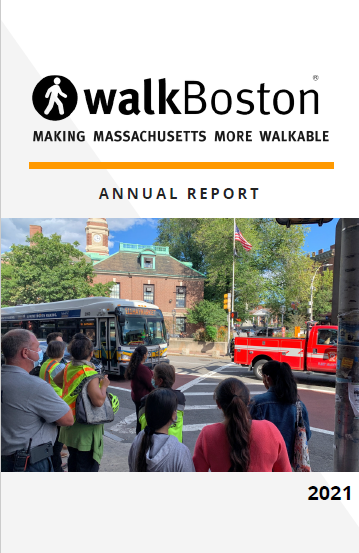 Image: WalkBoston 2021 Annual Report cover. A group of people wait on a sidewalk for a signal to change to cross a street. A bus and truck are driving through the intersection.